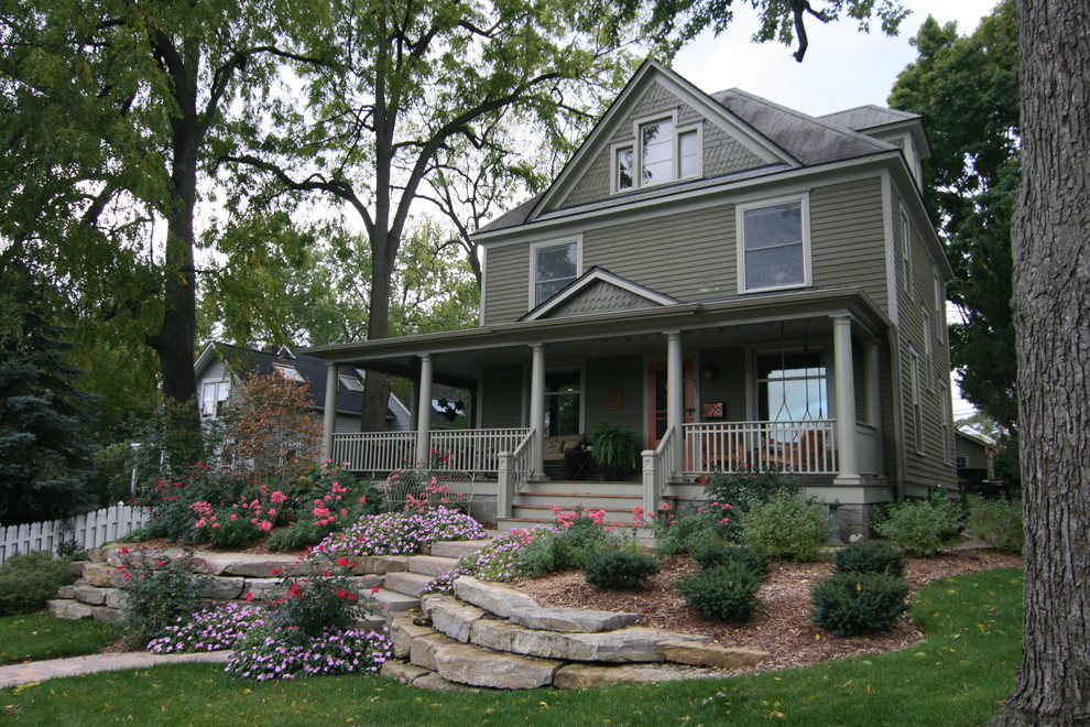 Inspiration for a mid-sized timeless stone front porch remodel in Detroit
