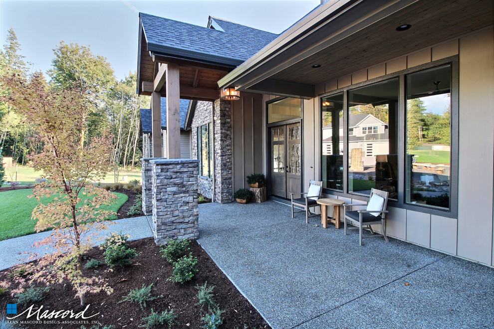 Imagen de terraza de estilo americano extra grande en patio delantero y anexo de casas con jardín de macetas y losas de hormigón