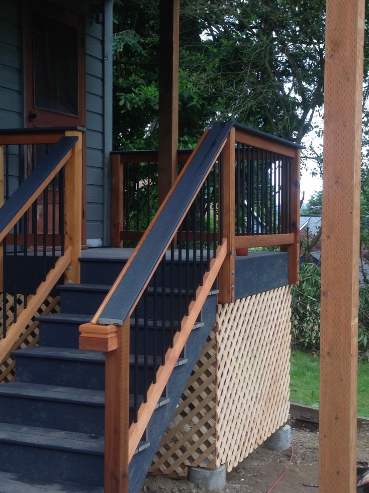Inspiration for a contemporary front porch remodel in Portland with a roof extension