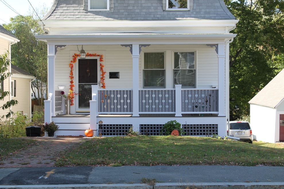 Small classic front porch idea in Boston with decking and a roof extension