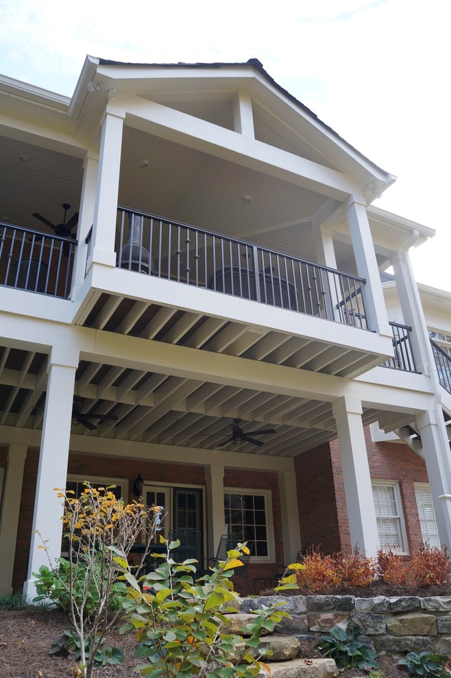 Large elegant porch photo in Atlanta with decking and a roof extension