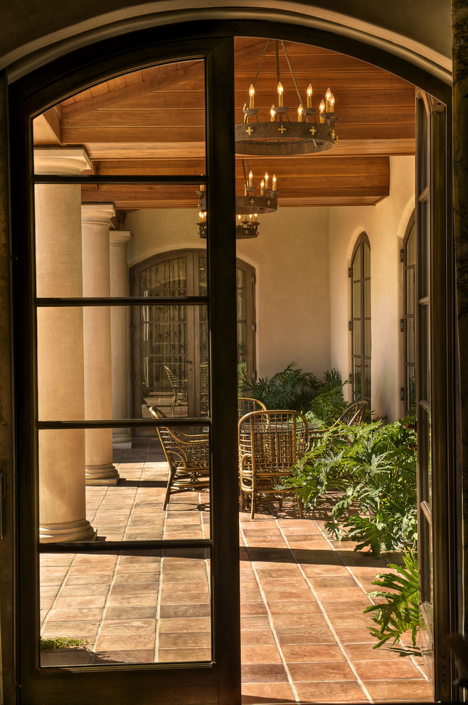 Tuscan porch photo in Other with a roof extension