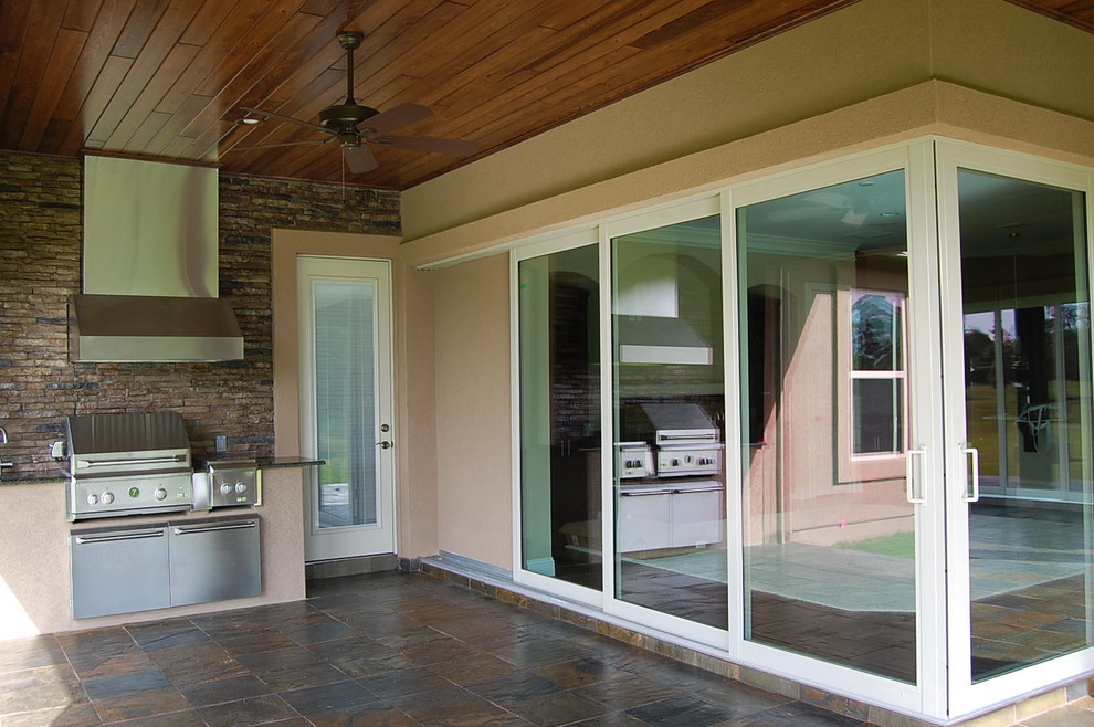 Large trendy tile porch photo in Jacksonville with a roof extension