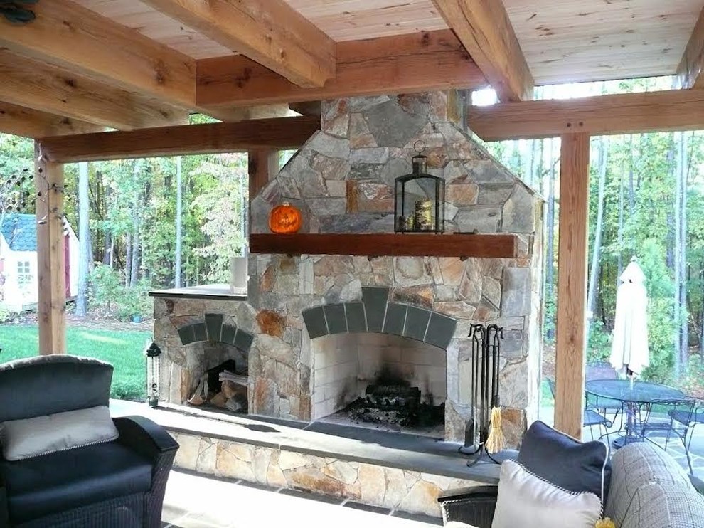 Inspiration for a rustic back porch remodel in Richmond with a fire pit and a roof extension