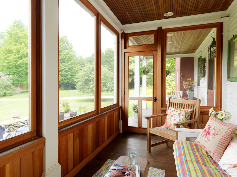 Photo of a rural front screened veranda in Burlington with all types of cover.