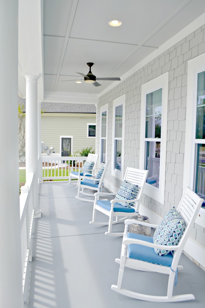 Design ideas for a coastal front veranda in Other with a roof extension.