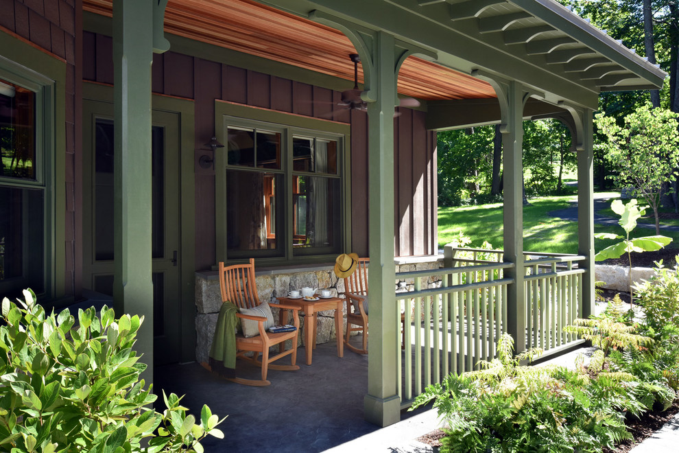 Design ideas for a small classic side veranda in New York with stamped concrete and a roof extension.