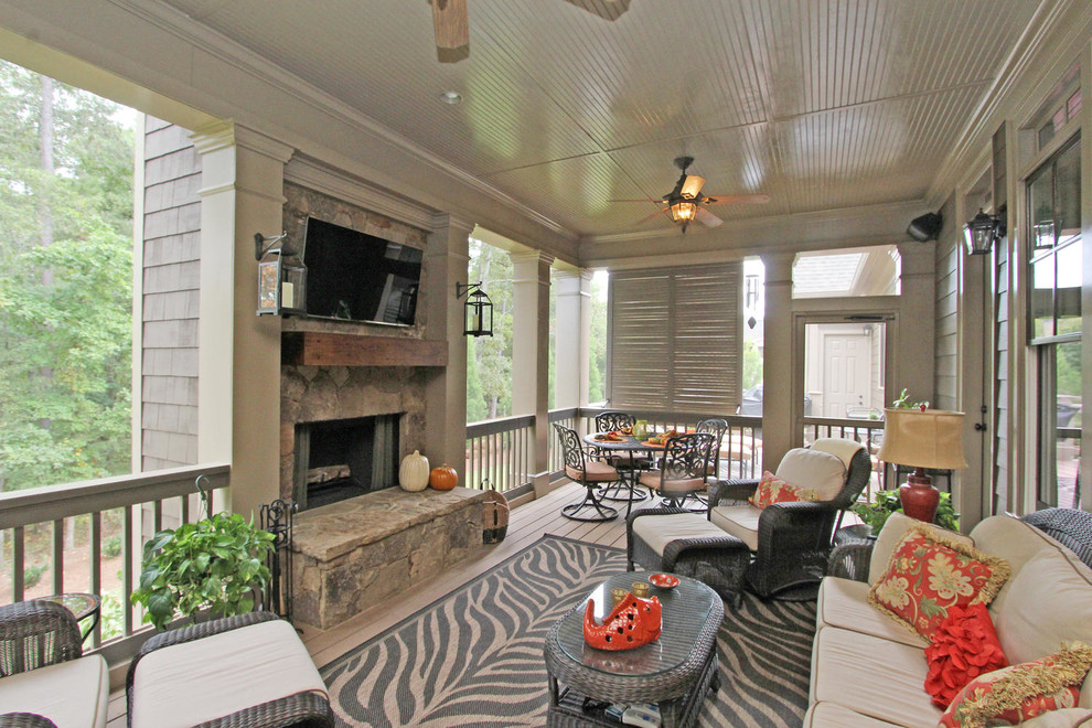 Photo of a large classic back veranda in Atlanta with decking, a roof extension and feature lighting.