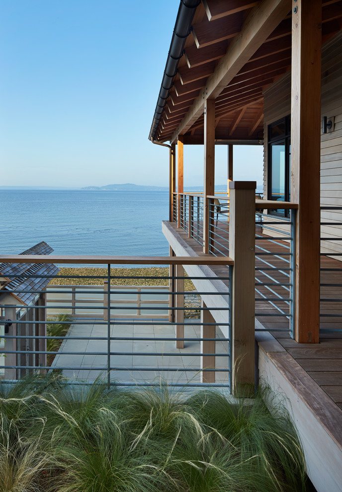 This is an example of a coastal porch design in Seattle.