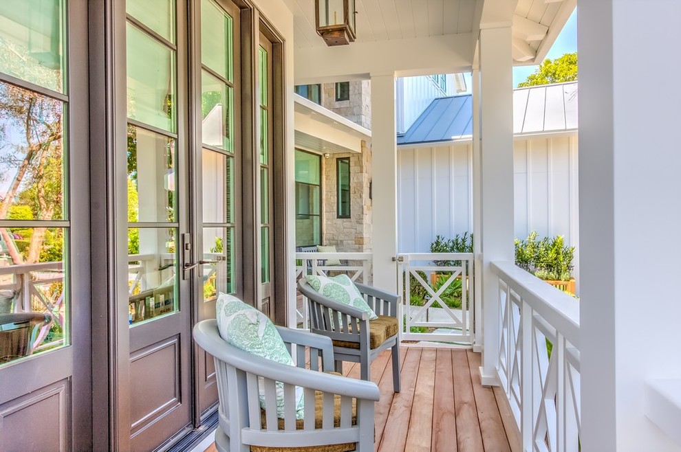 Inspiration for a medium sized farmhouse front veranda in Orange County with decking and a roof extension.