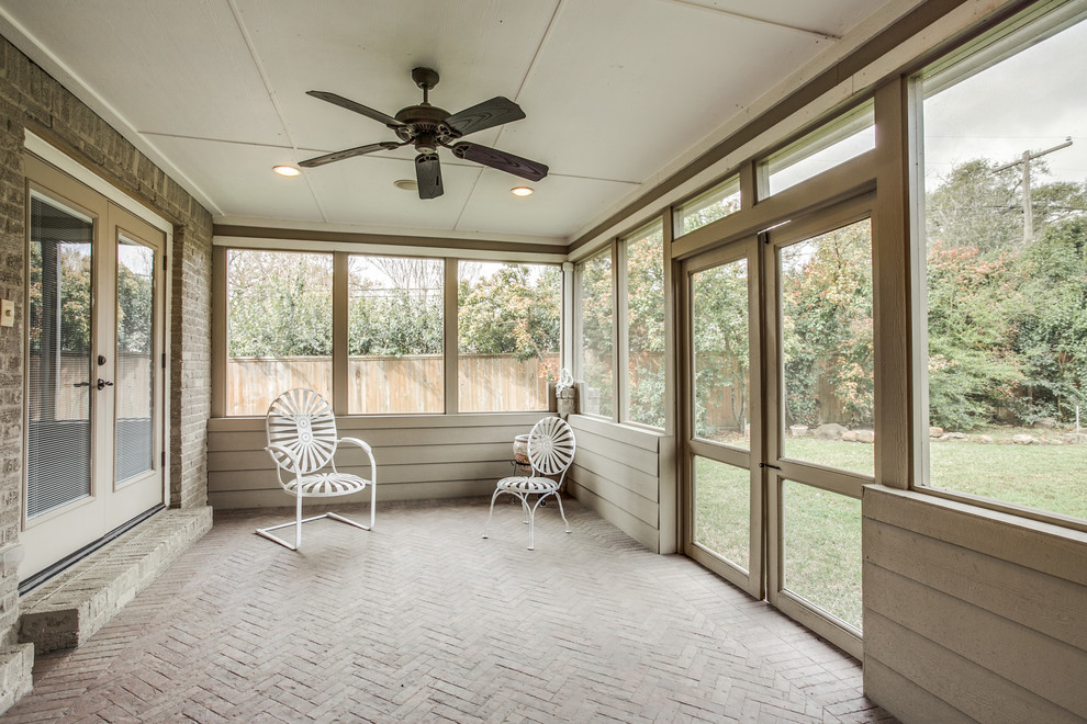 Design ideas for a large traditional front veranda in Dallas with a pergola.