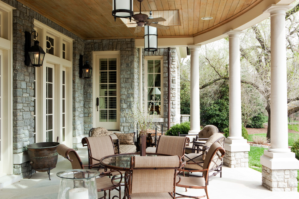 This is an example of a traditional porch design in Nashville with a roof extension.