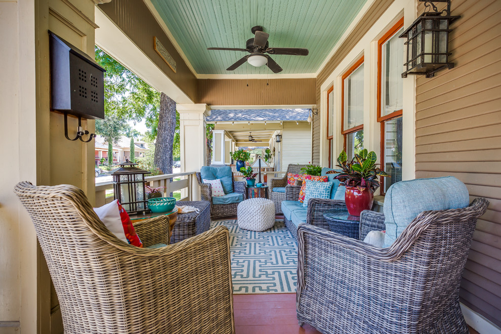 Small arts and crafts front porch idea in Dallas with decking and a roof extension