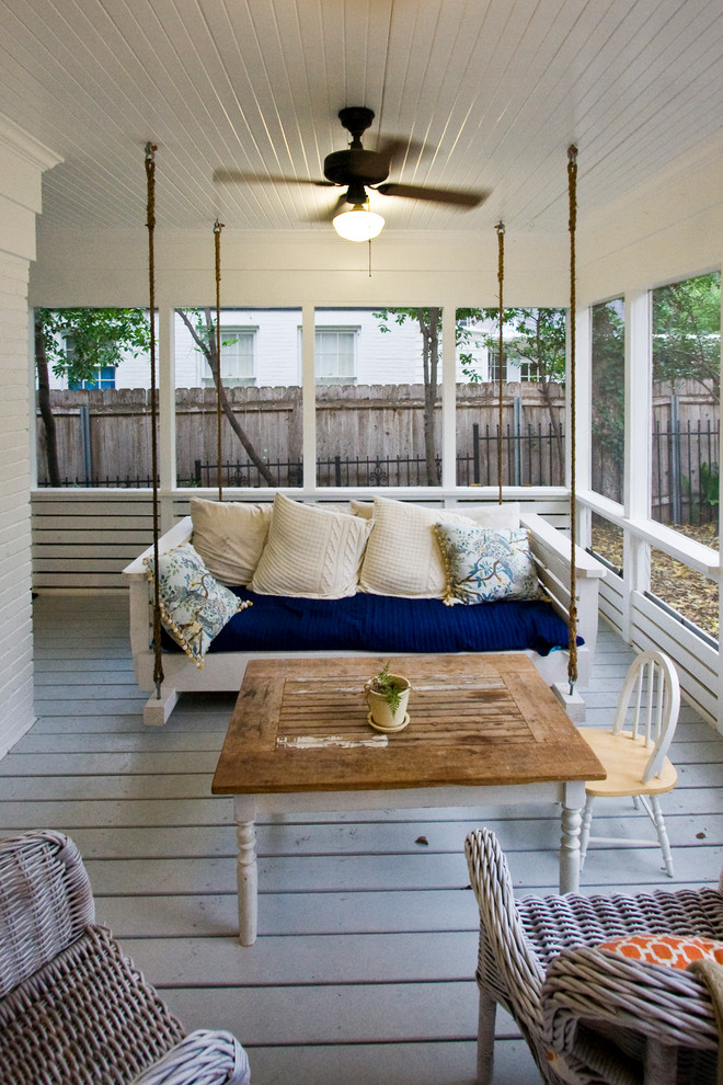 Inspiration for a farmhouse porch remodel in Austin with decking and a roof extension