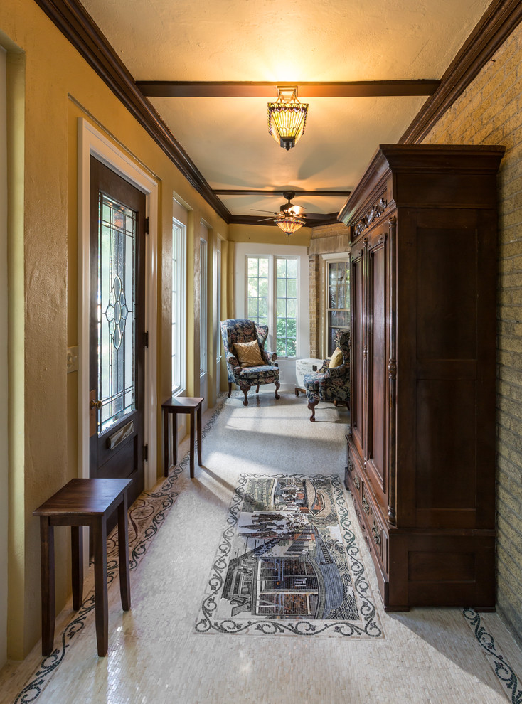Design ideas for a medium sized classic front veranda in Milwaukee with tiled flooring.