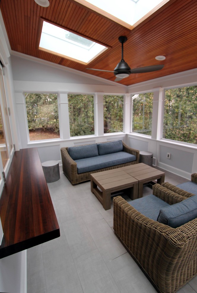 Large transitional tile screened-in back porch photo in DC Metro with a roof extension