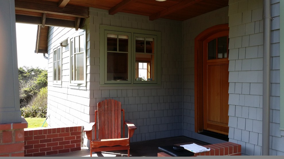 This is an example of a coastal veranda in Portland.