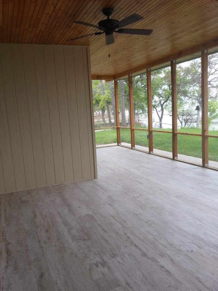 Large trendy screened-in back porch photo in Dallas with a roof extension