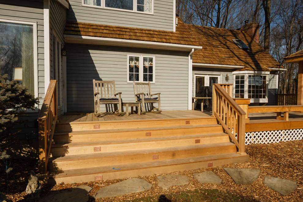 Photo of a large classic back veranda in Philadelphia with decking and a pergola.