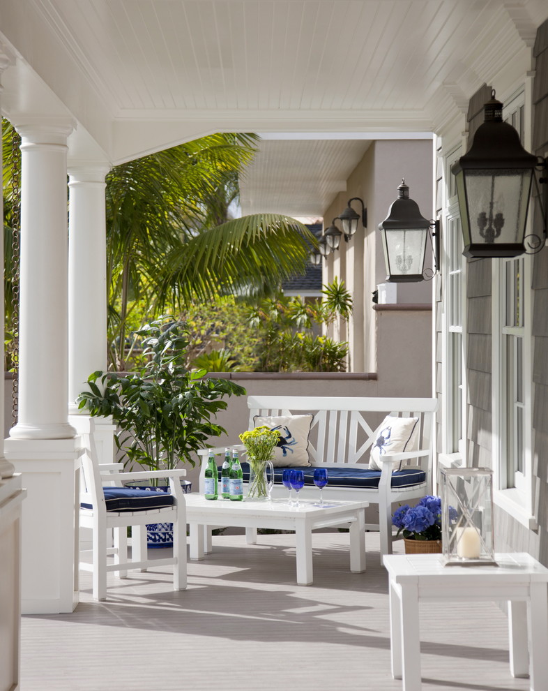 Inspiration for a coastal porch remodel in San Diego with a roof extension