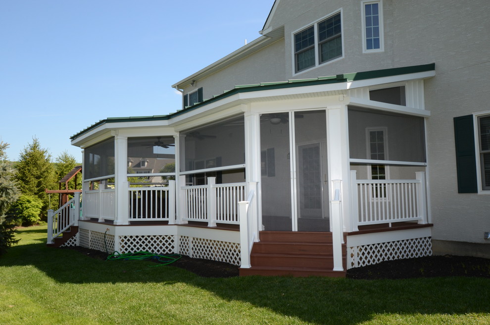 Inspiration for a medium sized classic back screened veranda in Philadelphia with decking and a roof extension.