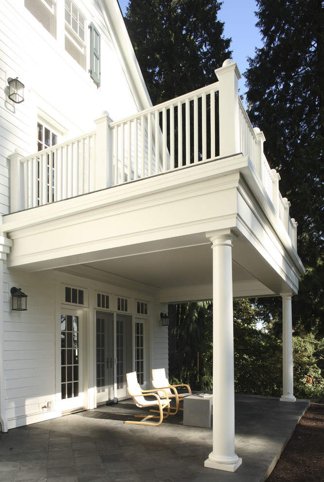Inspiration for a timeless porch remodel in Portland with a roof extension