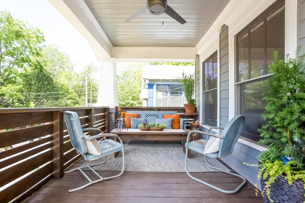 Inspiration for a traditional front veranda in Atlanta with decking and a roof extension.