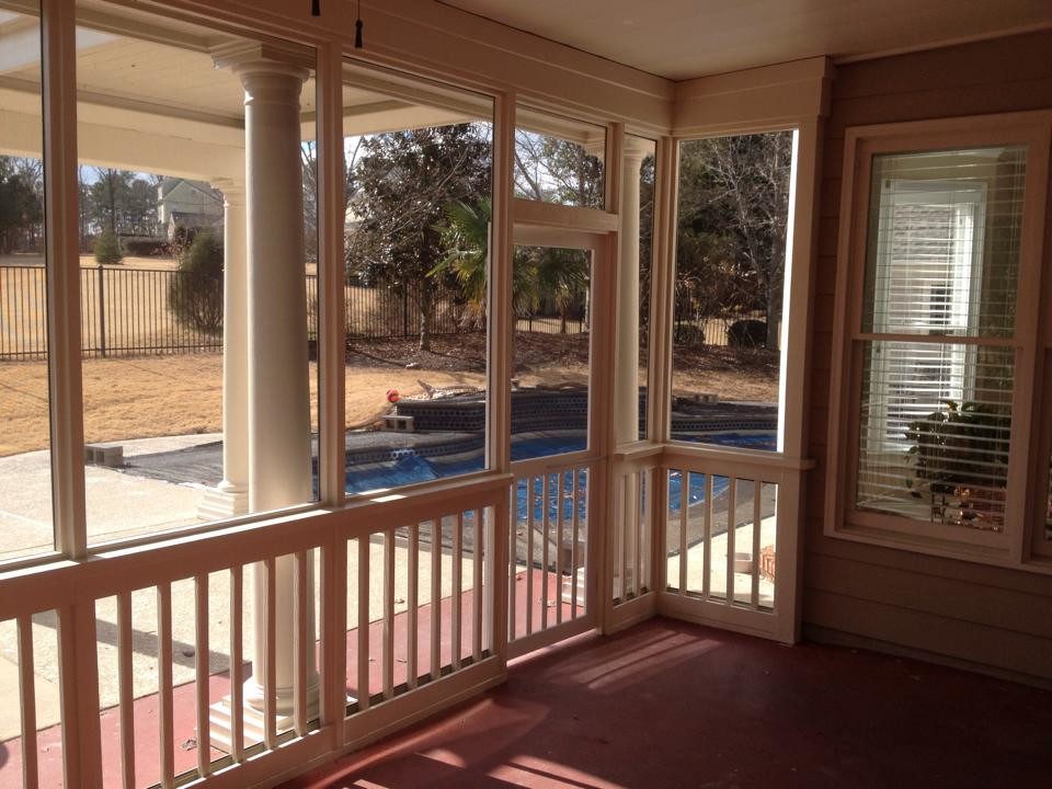 Inspiration for a medium sized classic back screened veranda in Atlanta with concrete slabs and a roof extension.