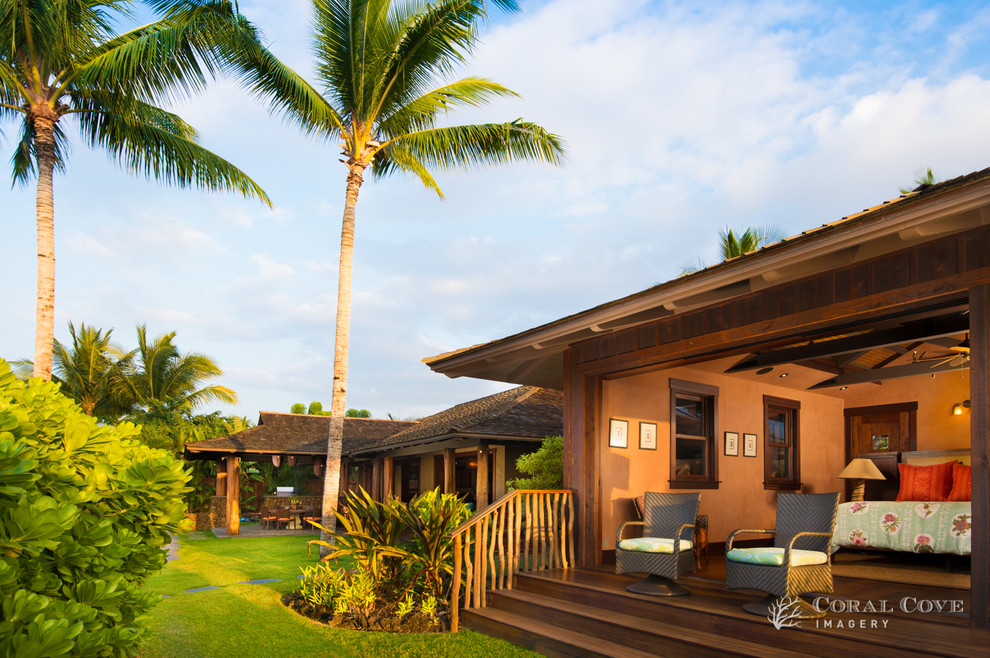 Large island style back porch photo in Hawaii with decking