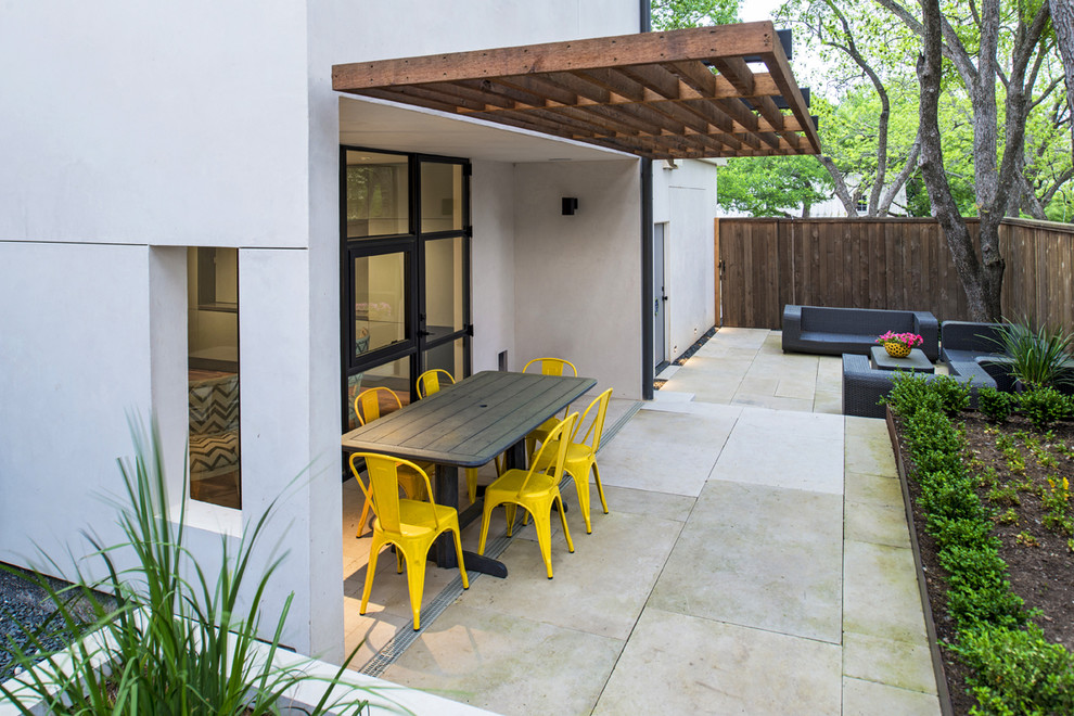 Design ideas for a medium sized contemporary back veranda in Austin with concrete paving and a roof extension.