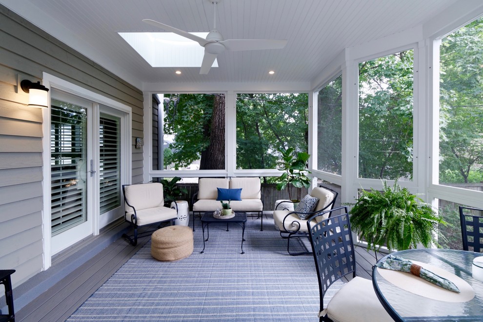 This is an example of a medium sized contemporary back screened veranda in Chicago with decking.
