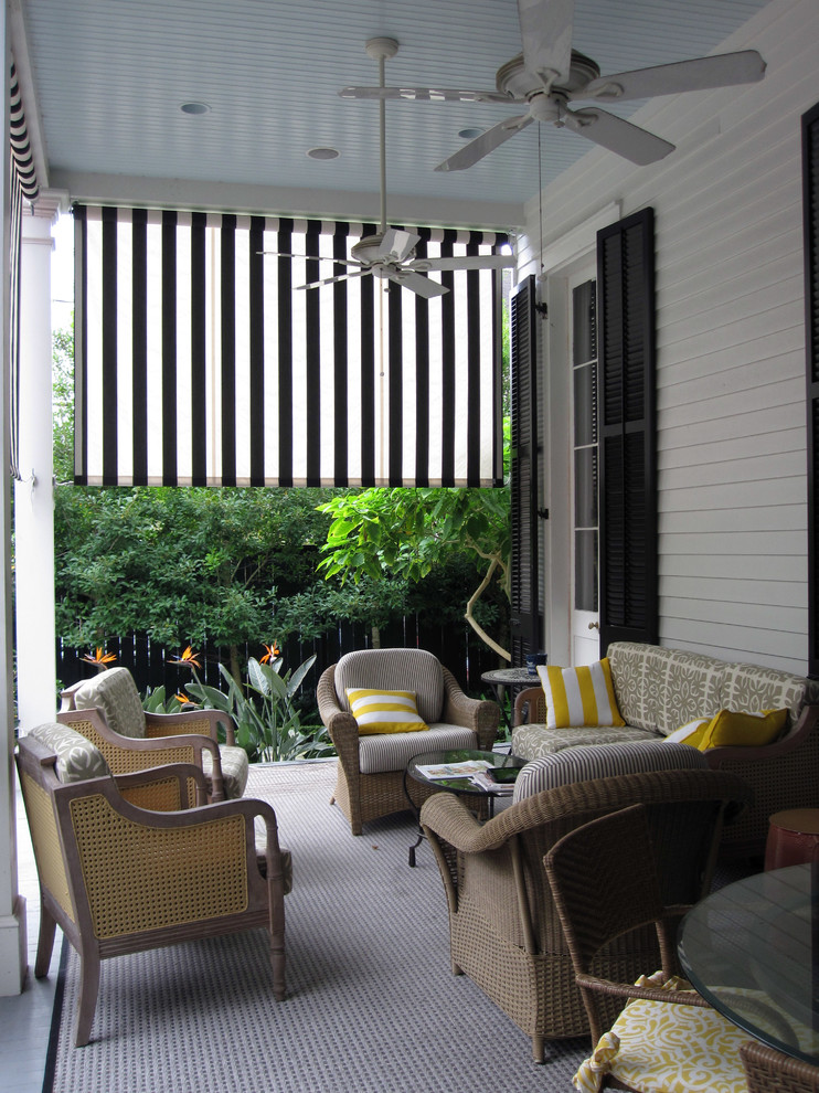 Classic veranda in New Orleans with a roof extension.