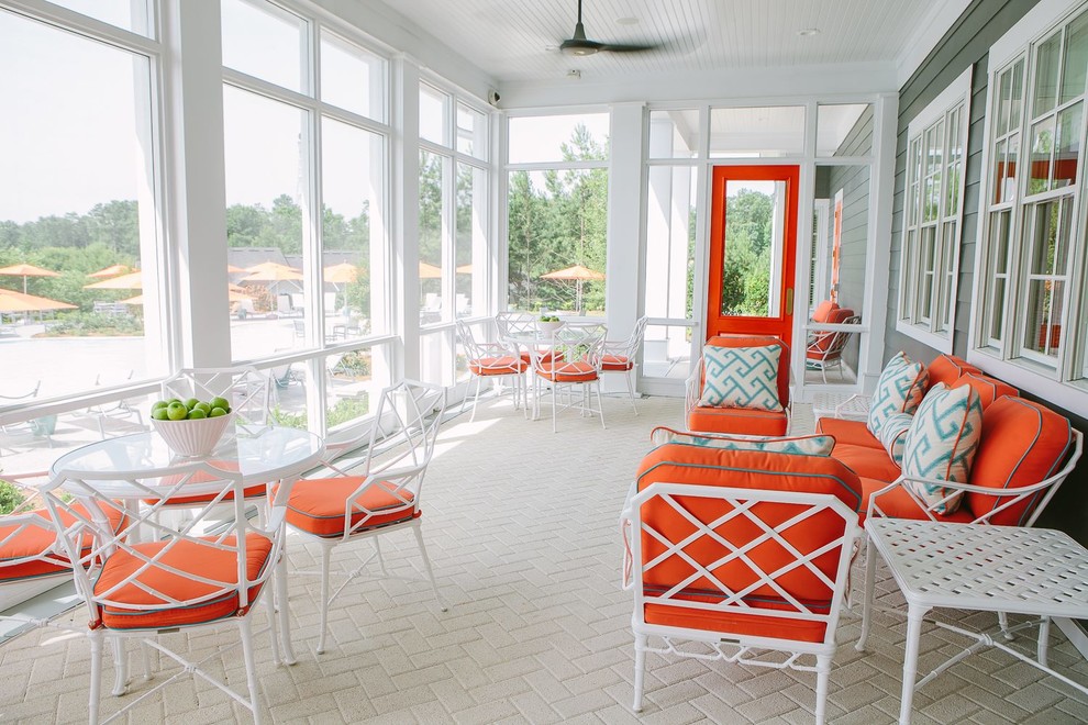 Inspiration for a huge coastal screened-in porch remodel in Atlanta with a roof extension