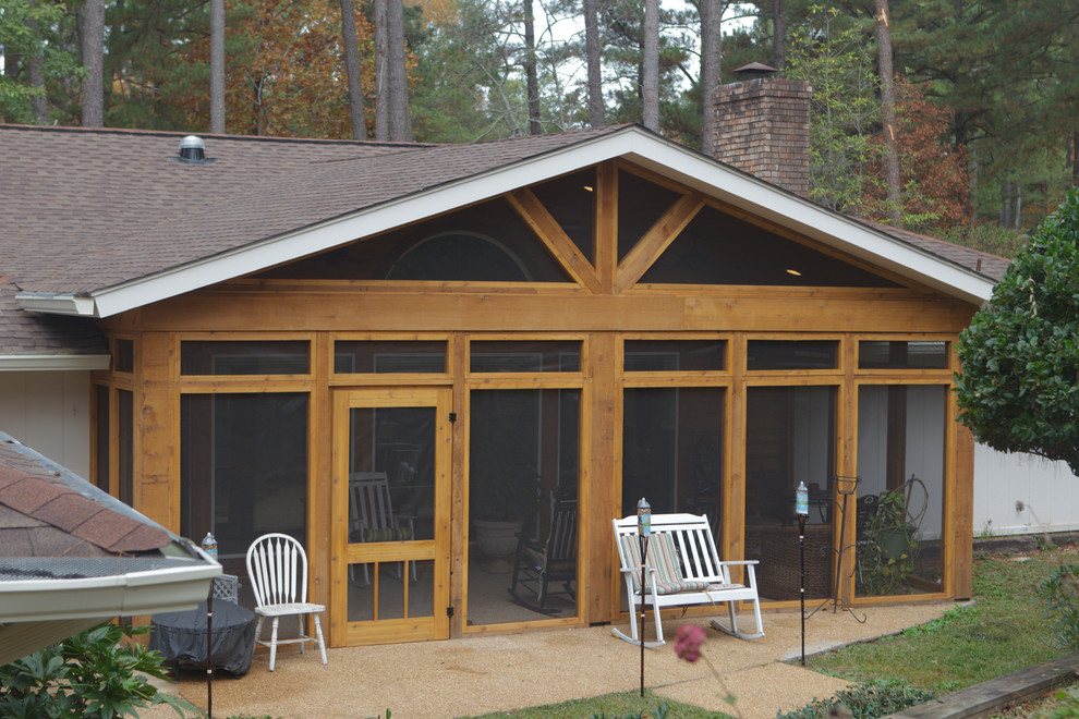 Photo of a medium sized traditional back screened veranda in Jackson with concrete slabs and a roof extension.