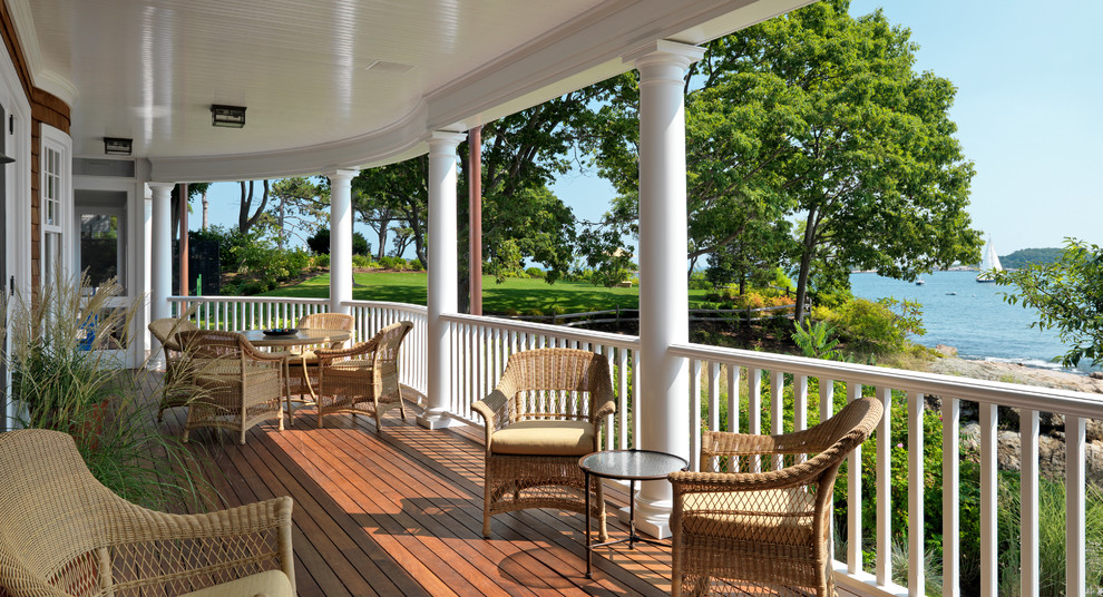Design ideas for a beach style veranda in Boston with decking and a roof extension.