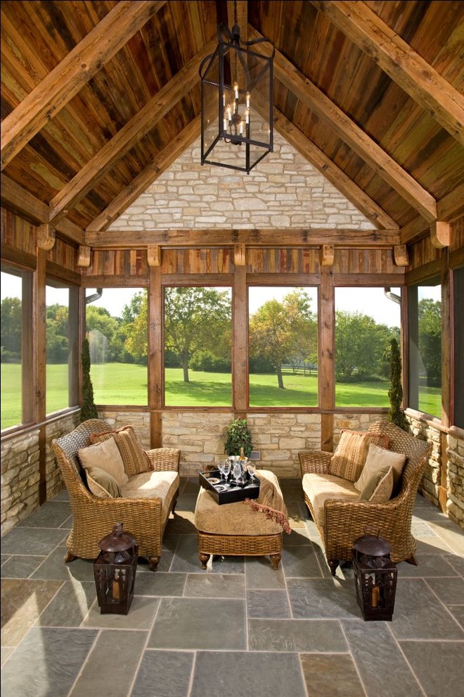 Inspiration for a rustic screened veranda in Chicago with a roof extension and all types of cover.