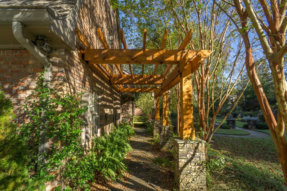 This is an example of a small rustic porch design in Atlanta with a pergola and decking.