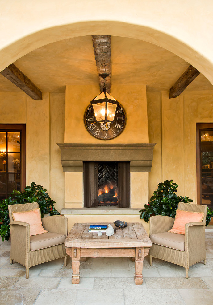 Inspiration for a mediterranean patio remodel in Los Angeles with a fire pit