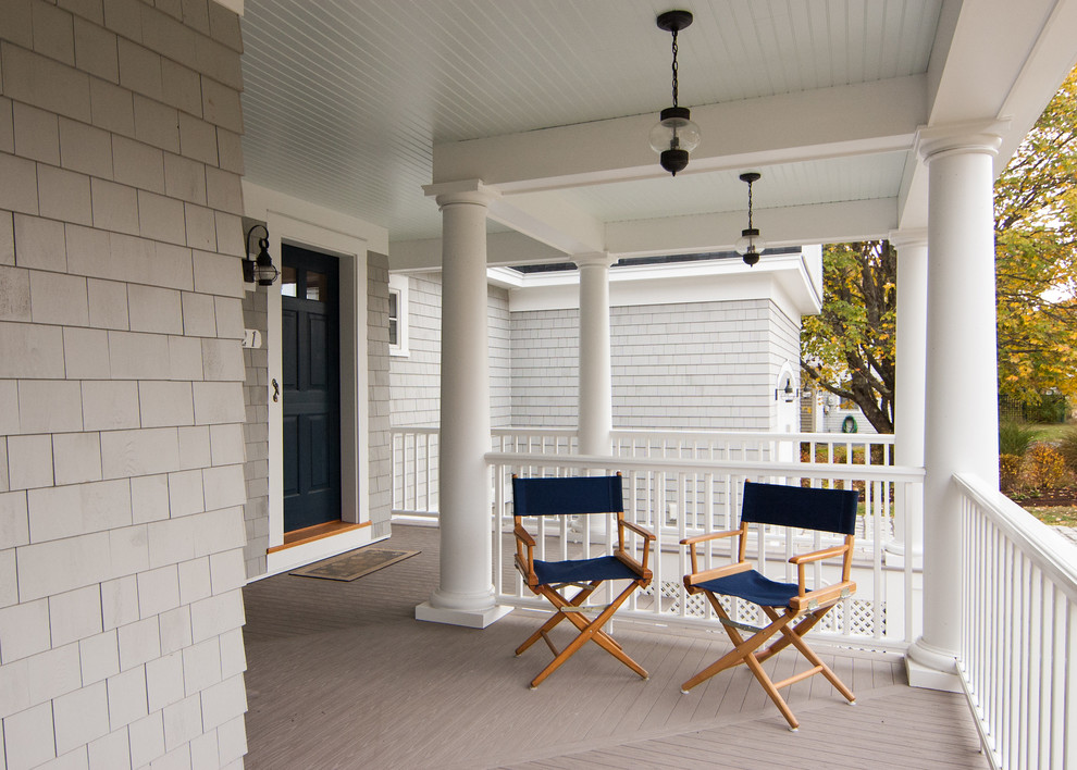 Mid-sized elegant front porch photo in Portland Maine with a roof extension