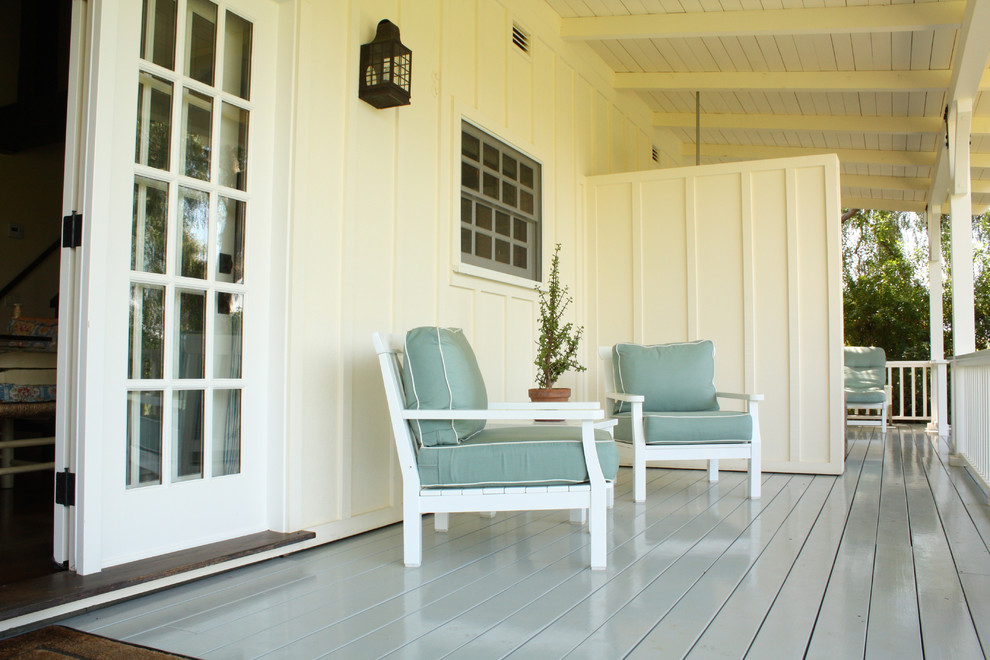 This is an example of a cottage porch design in Santa Barbara with decking and a roof extension.