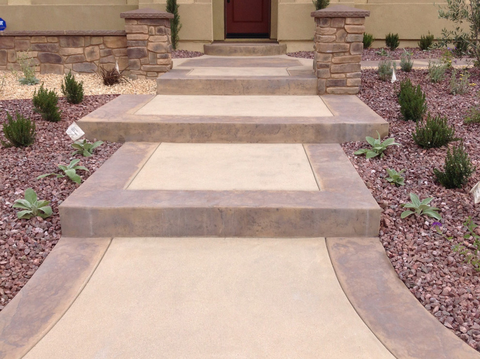 Inspiration for a mediterranean stamped concrete front porch remodel in Los Angeles