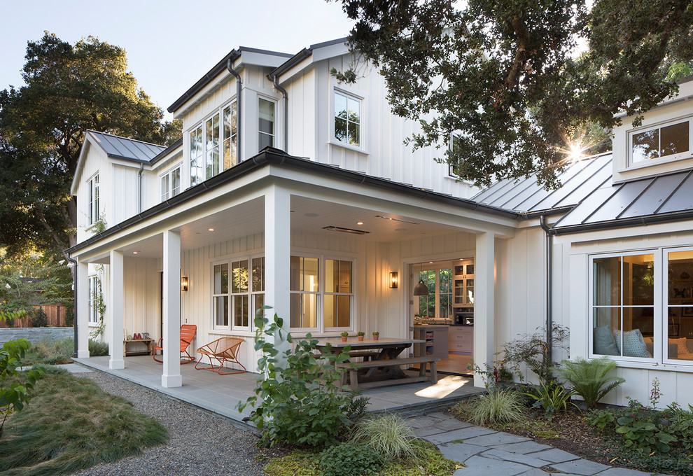 Mid-sized farmhouse stone side porch photo in San Francisco with a roof extension