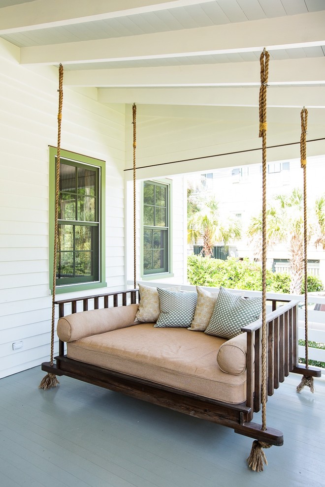 Classic front porch idea in Charleston with decking and a roof extension