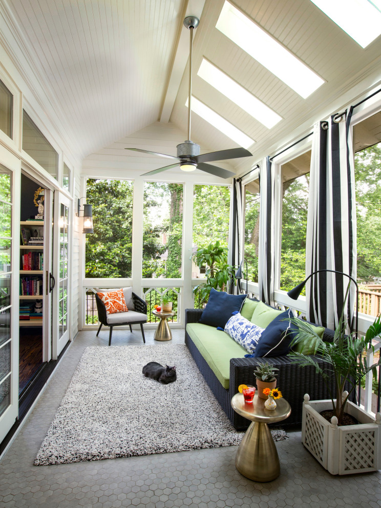 Classic veranda in Atlanta with tiled flooring, a roof extension and feature lighting.