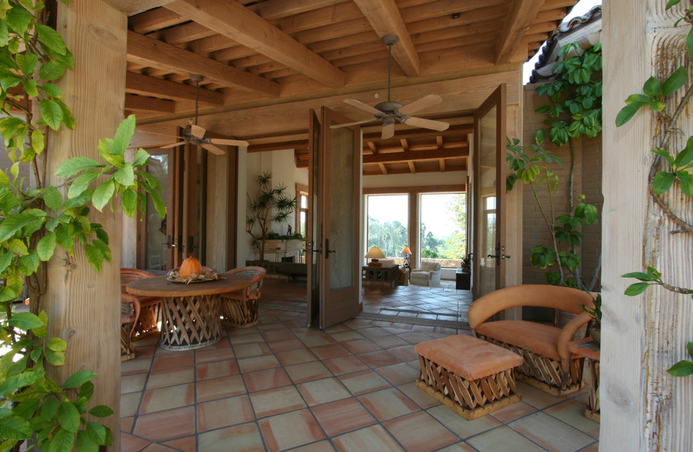 Inspiration for a traditional veranda in San Diego with a roof extension.