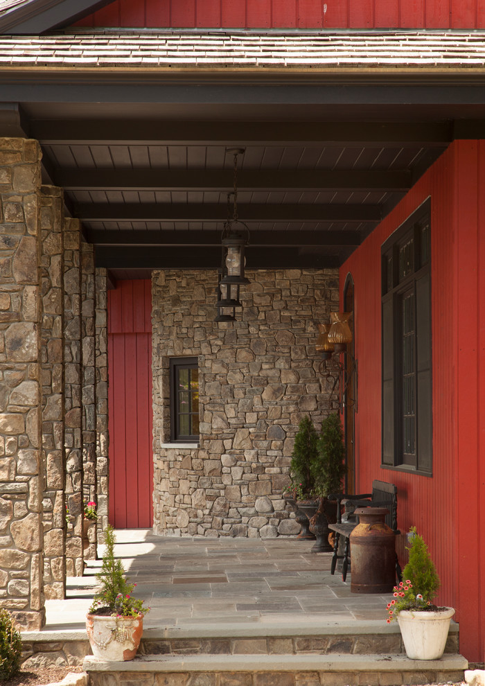 Farmhouse porch photo in New York with a roof extension