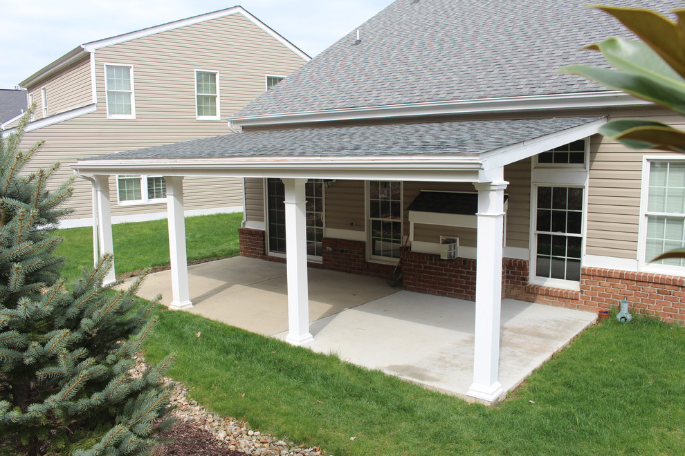 Design ideas for a traditional back veranda in Other with a roof extension.