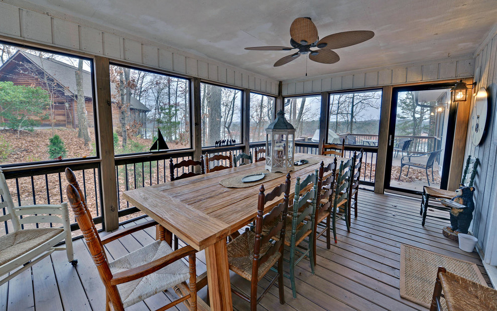 Large arts and crafts screened-in back porch photo in Atlanta with a roof extension and decking