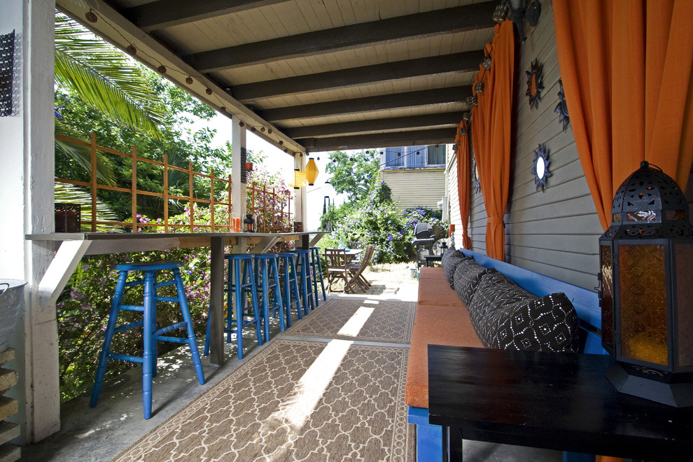 Tuscan porch photo in San Diego with a roof extension