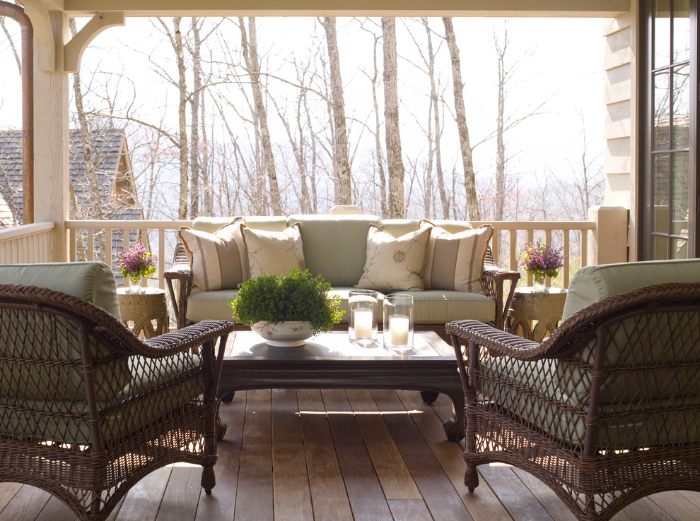 Large classic side porch idea in Raleigh with a roof extension